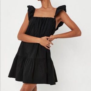 Black frill sleeve dress. Brand new in original packaging with tags